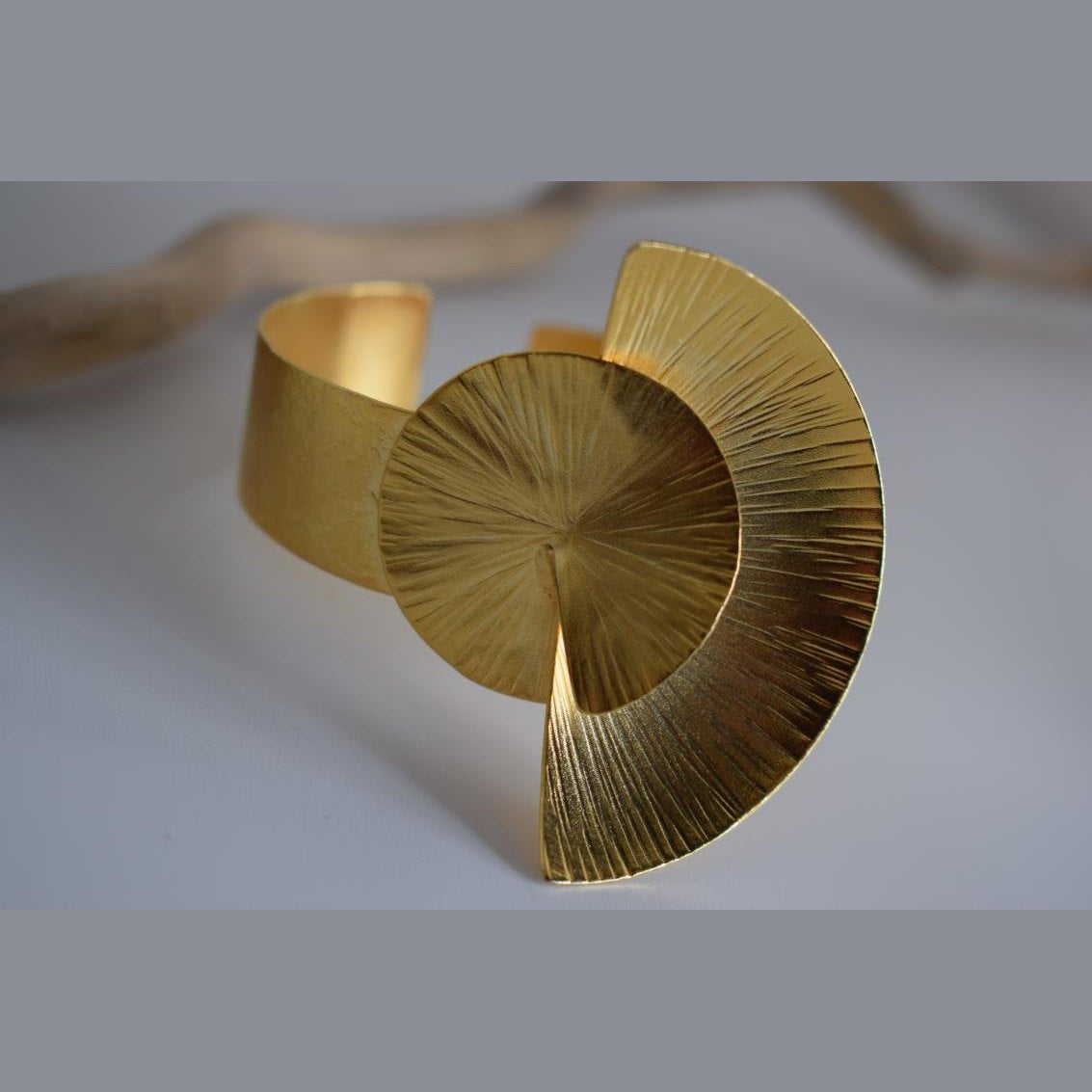 Kochlias bracelet Greek hammered jewelry spiral seashell design in 18K gold, silver, and rose gold plated finish.