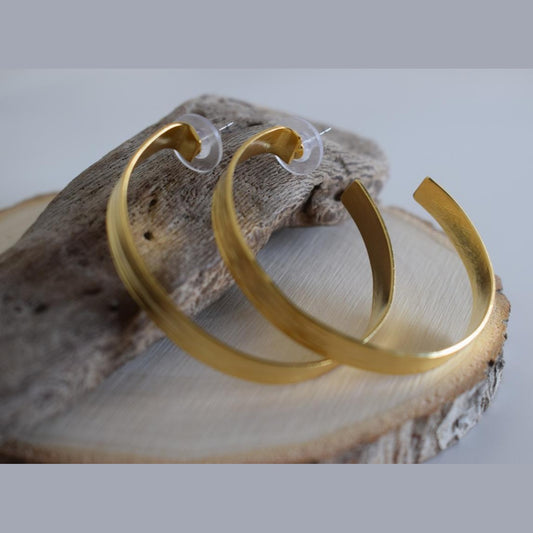 Eos2 earrings in handmade Greek hammered jewelry, featuring open hoop design and available in 18K gold plated and silver plated finishes.