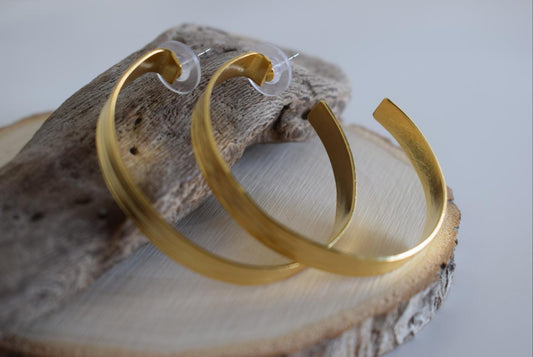 Eos2 earrings in handmade Greek hammered jewelry, featuring open hoop design and available in 18K gold plated and silver plated finishes.