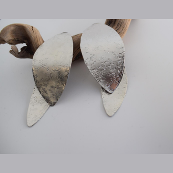 Nymphe Earrings – Greek Hammered Jewelry – Available in 18K Gold, Silver, and Rose Gold Plated. Handmade elongated hammered leaf-inspired design, symbolizing the grace of ancient nymphs.