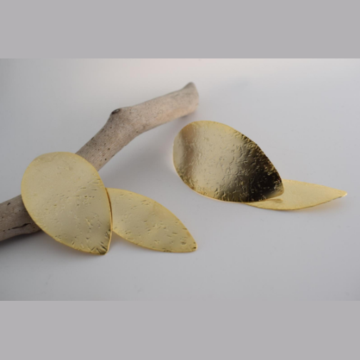 Nymphe Earrings – Greek Hammered Jewelry – Available in 18K Gold, Silver, and Rose Gold Plated. Handmade elongated hammered leaf-inspired design, symbolizing the grace of ancient nymphs.