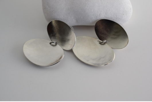 Heliades Earrings – Greek Hammered Jewelry – Available in 18K Gold, Silver, and Rose Gold Plated. Radiant hammered circular discs inspired by the daughters of the Sun.