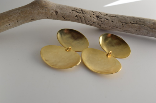 Heliades Earrings – Greek Hammered Jewelry – Available in 18K Gold, Silver, and Rose Gold Plated. Radiant hammered circular discs inspired by the daughters of the Sun.