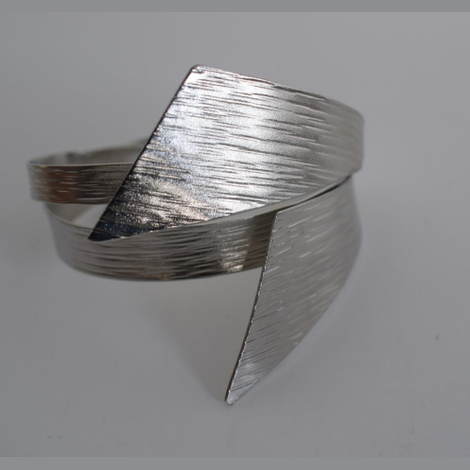 Handmade sculptural wrap bracelet with textured finish inspired by the draped folds of the ancient Greek chiton garment, available in gold, silver, or rose gold plating.