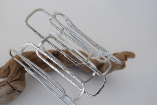 Geometria Bracelet – Greek Hammered Jewelry – Available in 18K Gold, Silver, and Rose Gold Plated. Interlocking hammered rectangles inspired by Greek geometry.