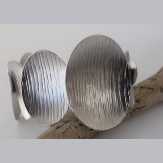 Ostraka Bracelet – Greek Hammered Jewelry – Available in 18K Gold, Silver, and Rose Gold Plated. Bold hammered ovals inspired by ancient shards and seashells.