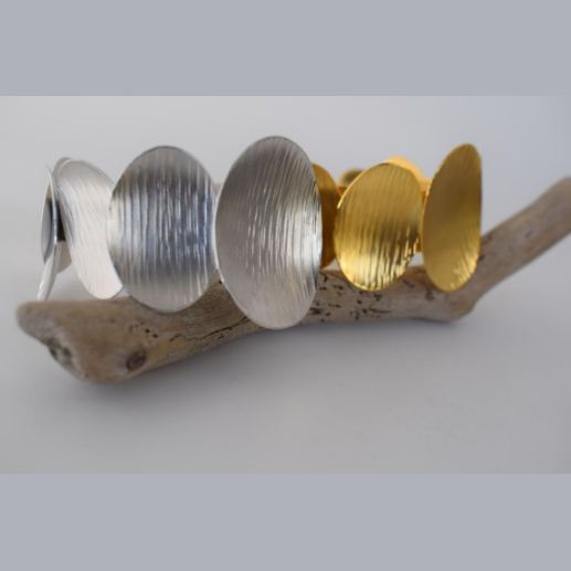 Ostraka Bracelet – Greek Hammered Jewelry – Available in 18K Gold, Silver, and Rose Gold Plated. Bold hammered ovals inspired by ancient shards and seashells.