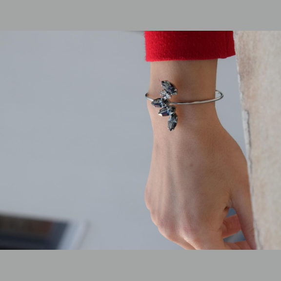 Handmade open cuff bracelet with marquise-cut Swarovski crystals arranged in a leaf pattern, inspired by the Amaryllis flower in ancient Greek culture, available in gold, silver, or rose gold plating.