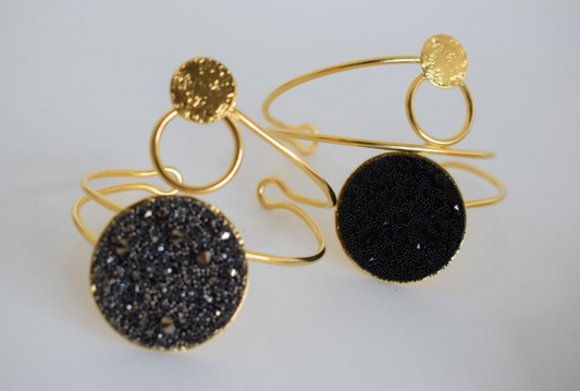 Handmade open cuff bracelet with Swarovski-studded disc inspired by the Milky Way, available in gold, silver, or rose gold plating.