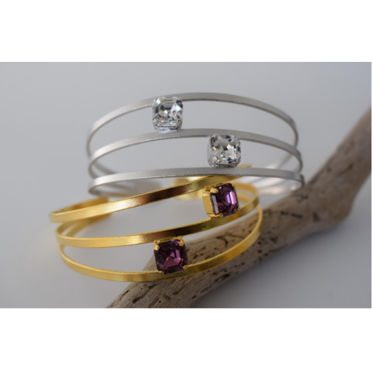 Hesperides Bracelet – Greek Hammered Jewelry – Available in 18K Gold, Silver, and Rose Gold Plated With Crystal. Double-band hammered design inspired by the nymphs of Greek mythology.