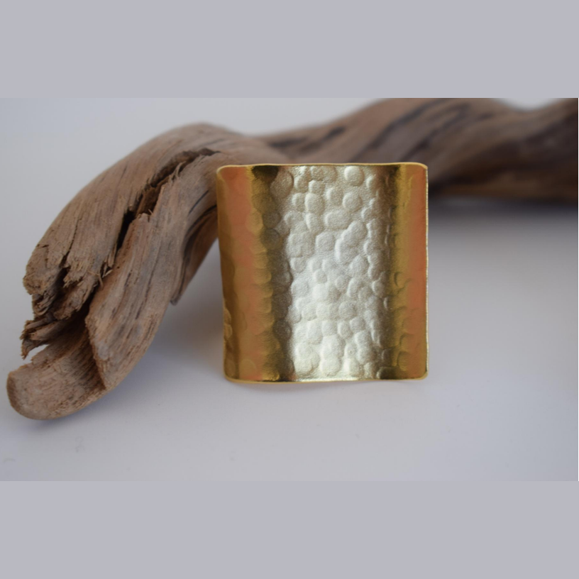 Aegis Ring – Greek Hammered Jewelry – Available in 18K Gold, Silver, and Rose Gold Plated. Wide handmade hammered shield design inspired by the mythical Aegis of Zeus and Athena.