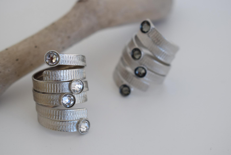 Aetheras Ring – Greek Hammered Jewelry – Available in 18K Gold, Silver, and Rose Gold Plated With Crystal. Spiral hammered design, adjustable, hypoallergenic, handcrafted.