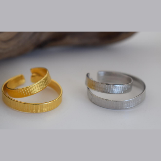 Aitheras Ring – Greek Hammered Jewelry – Available in 18K Gold, Silver, and Rose Gold Plated. Adjustable spiral ring with engraved linear texture, inspired by the ancient Greek symbol of aether, the upper sky.