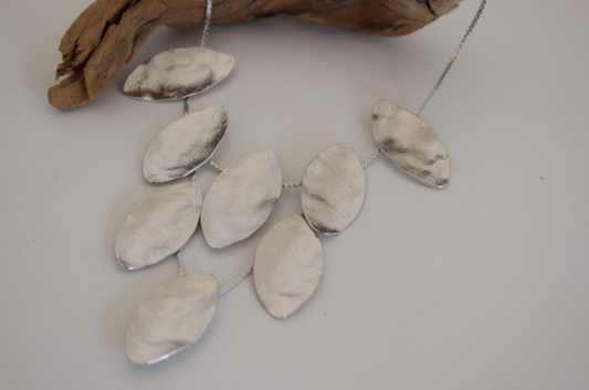 Handmade hammered necklace with gold-plated leaf shapes inspired by Greek nature and mythology.