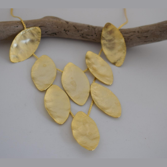 Handmade hammered necklace with gold-plated leaf shapes inspired by Greek nature and mythology.