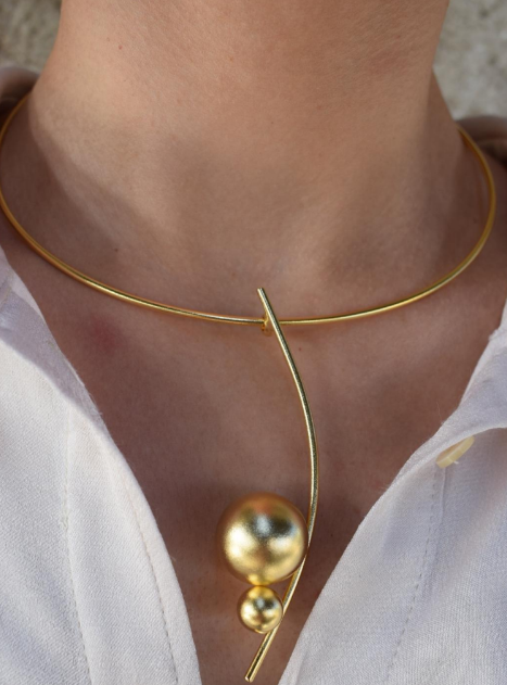 Handmade gold-plated choker necklace with two golden spheres inspired by the cosmos, Greek hammered jewelry design.