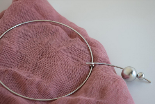 Handmade gold-plated choker necklace with two golden spheres inspired by the cosmos, Greek hammered jewelry design.