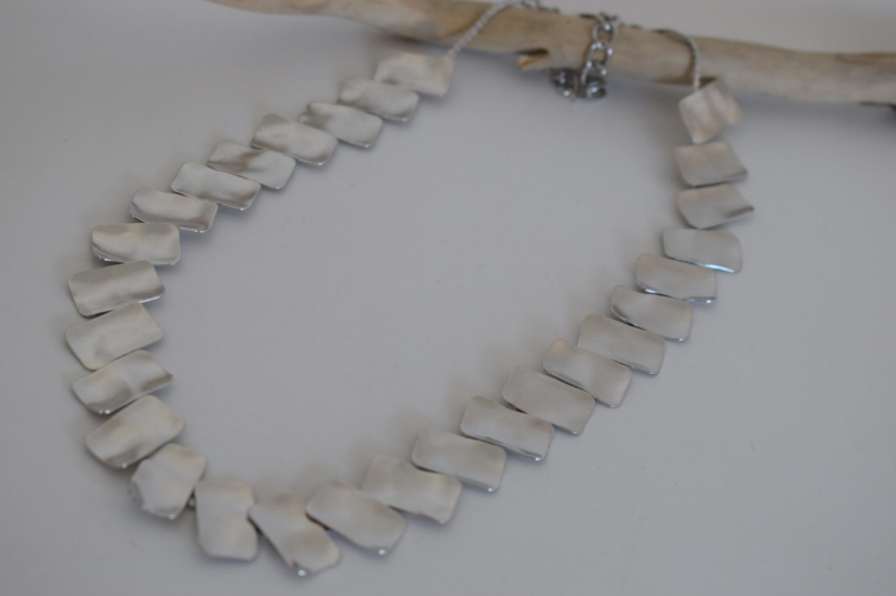 Handmade hammered necklace with rectangular gold-plated plates inspired by the poetic elegance of gold in ancient Greek culture.