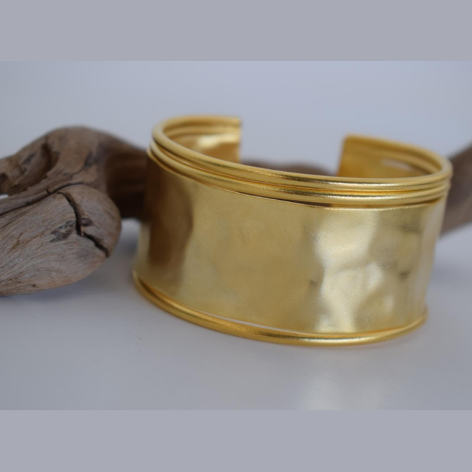 Handmade wide hammered cuff bracelet in 18k gold plated and silver plated finish, inspired by the ancient Greek Aegis