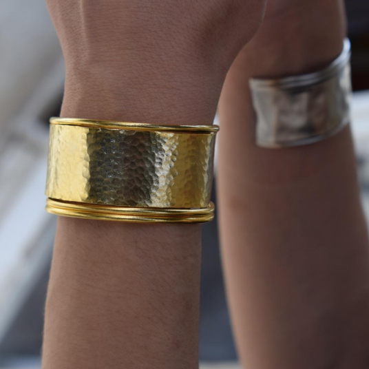 Handmade wide hammered cuff bracelet in 18k gold plated and silver plated finish, inspired by the ancient Greek Aegis