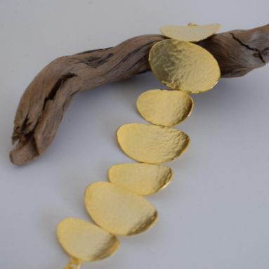 Handmade hammered disc bracelet in 18k gold plated finish, inspired by ancient Greek design