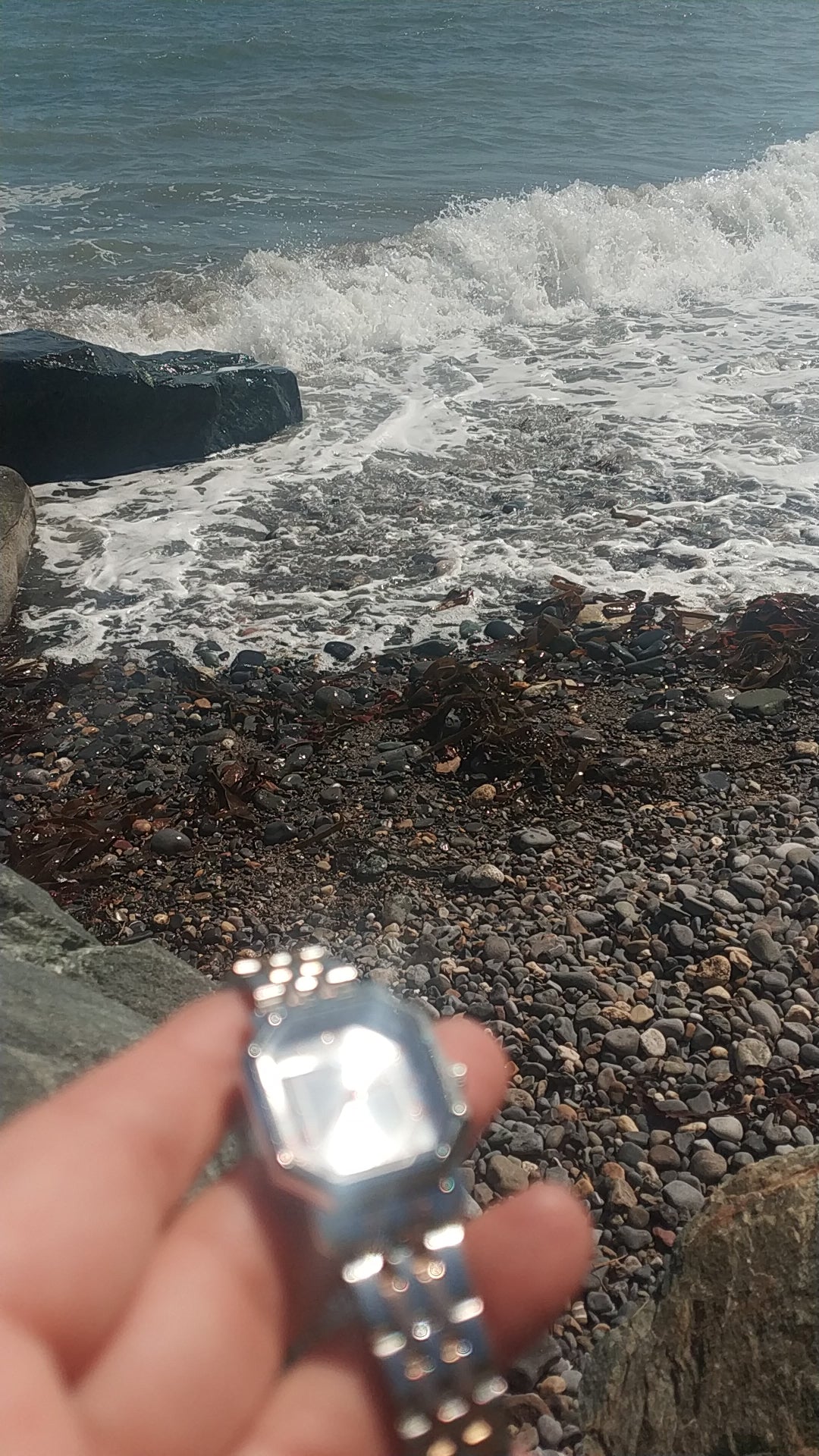 Women’s silver stainless steel watch with octagon dial and rose gold Roman numerals – elegant modern accessory