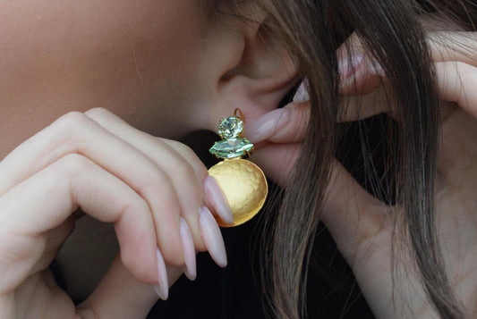 Santorini earrings with crystal – Greek hammered jewelry in 18K gold plated, 18K silver plated, and rose gold plated. Handcrafted earrings with hammered discs and sparkling crystals inspired by the island of Santorini.