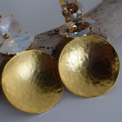 Santorini earrings with crystal – Greek hammered jewelry in 18K gold plated, 18K silver plated, and rose gold plated. Handcrafted earrings with hammered discs and sparkling crystals inspired by the island of Santorini.
