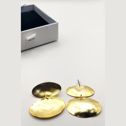 Heliades Earrings – Greek Hammered Jewelry – Available in 18K Gold, Silver, and Rose Gold Plated. Radiant hammered circular discs inspired by the daughters of the Sun.