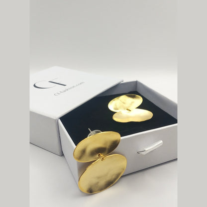 Heliades Earrings – Greek Hammered Jewelry – Available in 18K Gold, Silver, and Rose Gold Plated. Radiant hammered circular discs inspired by the daughters of the Sun.