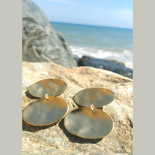 Heliades Earrings – Greek Hammered Jewelry – Available in 18K Gold, Silver, and Rose Gold Plated. Radiant hammered circular discs inspired by the daughters of the Sun.