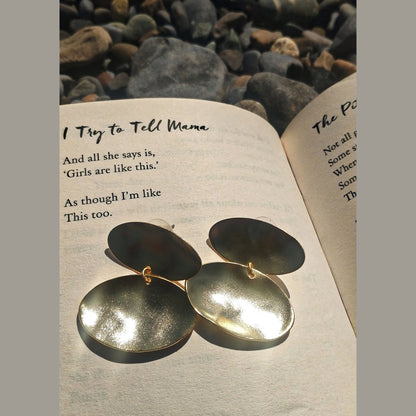 Heliades Earrings – Greek Hammered Jewelry – Available in 18K Gold, Silver, and Rose Gold Plated. Radiant hammered circular discs inspired by the daughters of the Sun.
