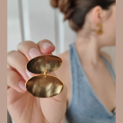 Heliades Earrings – Greek Hammered Jewelry – Available in 18K Gold, Silver, and Rose Gold Plated. Radiant hammered circular discs inspired by the daughters of the Sun.