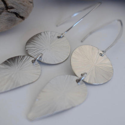Handmade 18k gold plated earrings with sunburst disc and elongated leaf design, inspired by ancient Greek artistry

