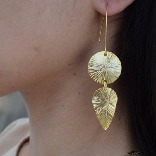 Handmade 18k gold plated earrings with sunburst disc and elongated leaf design, inspired by ancient Greek artistry


