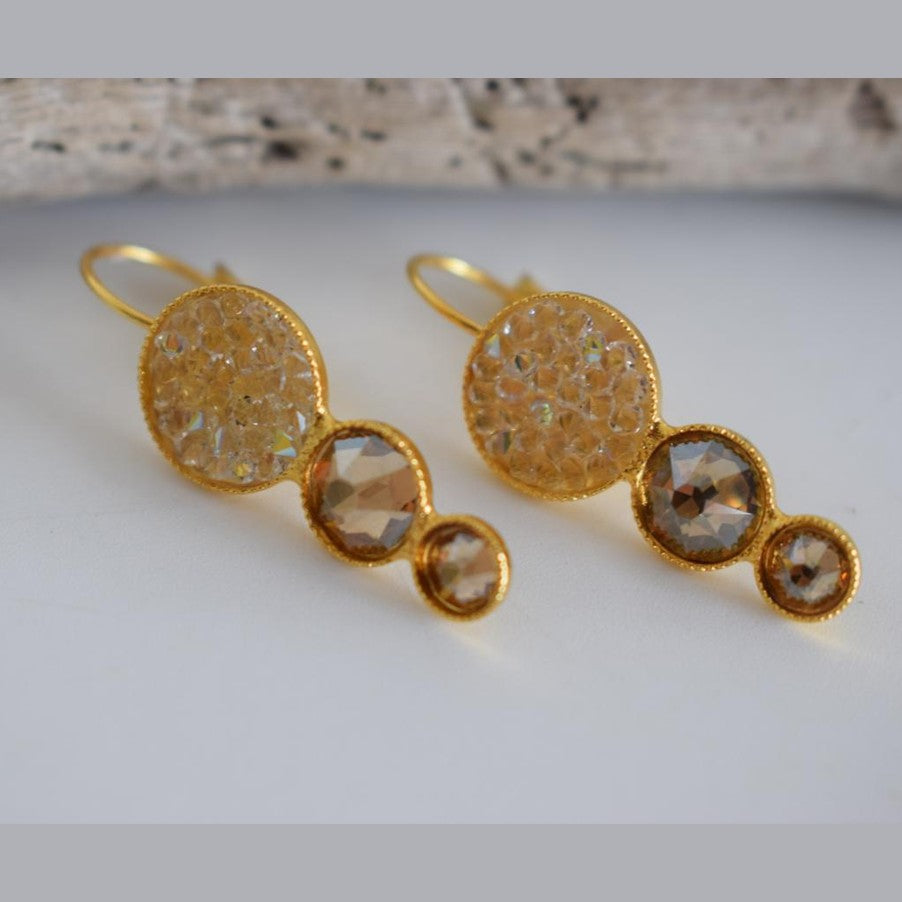 Seleni4 earrings in handmade Greek hammered jewelry design with fine crystals, available in gold plated and silver plated finishes.