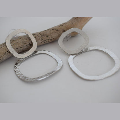 Aegis earrings in handmade Greek hammered jewelry design, available in gold plated and silver plated finishes.