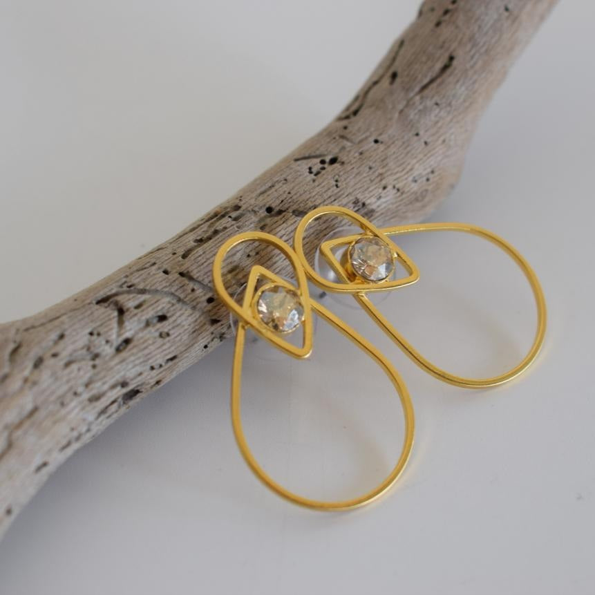 Nereis earrings in handmade Greek hammered jewelry design with fine crystals, available in gold plated and silver plated finishes.