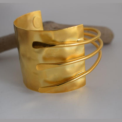Mycenae bracelet – Greek hammered jewelry with layered cuff design, inspired by Mycenaean treasures, available in 18K gold-plated, 18K silver-plated, and rose-gold plated finishes.