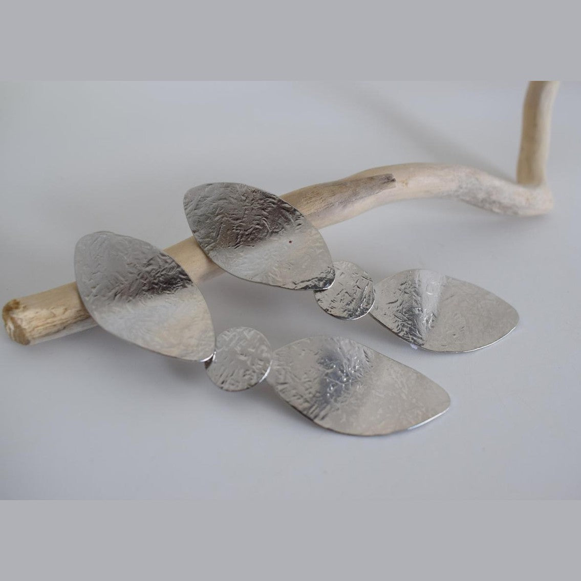 Calypso2 earrings in handmade Greek hammered jewelry design, available in gold plated and silver plated finishes.