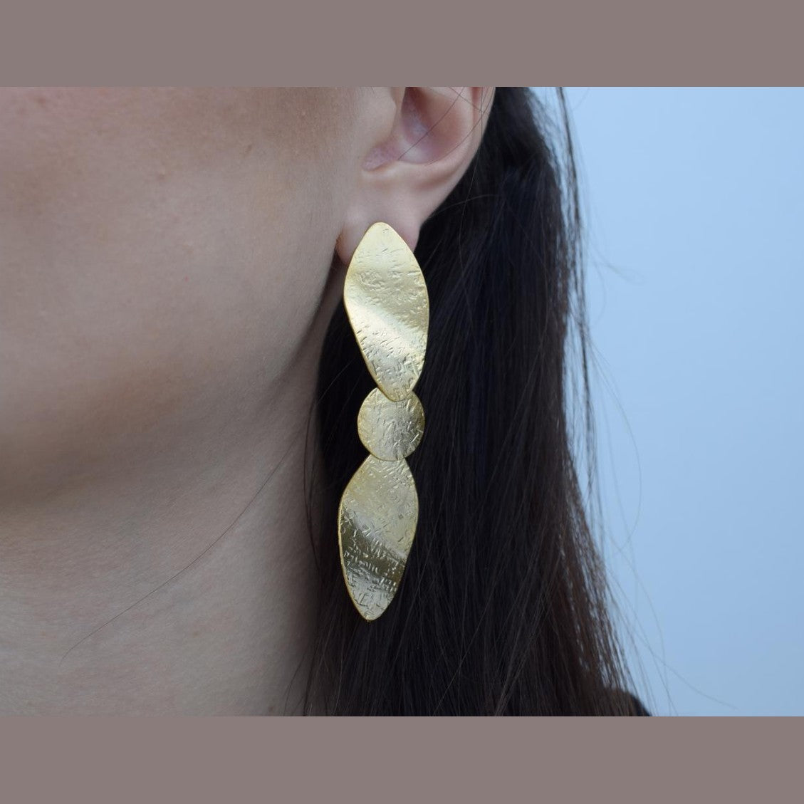 Calypso2 earrings in handmade Greek hammered jewelry design, available in gold plated and silver plated finishes.