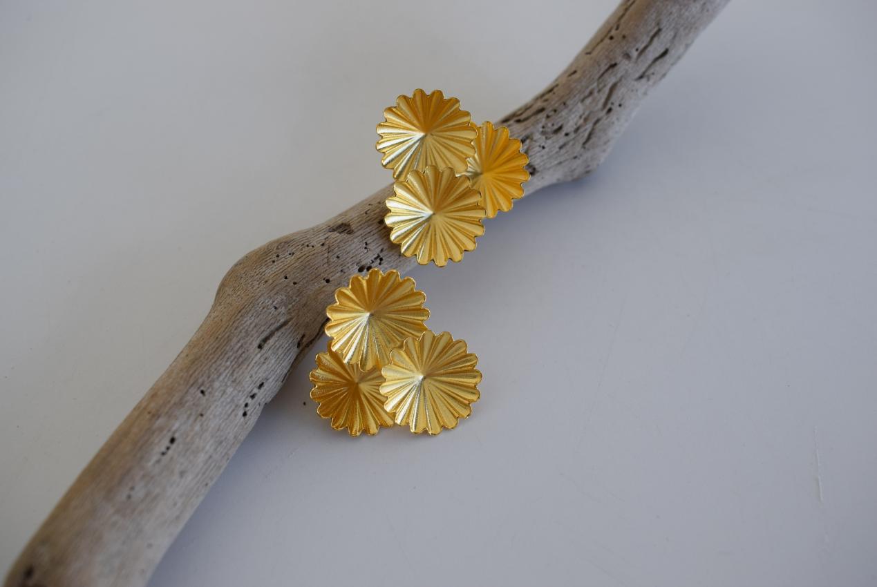 Florina earrings in Greek hammered jewelry design with floral texture, available in 18K gold plated and 18K silver plated finishes.