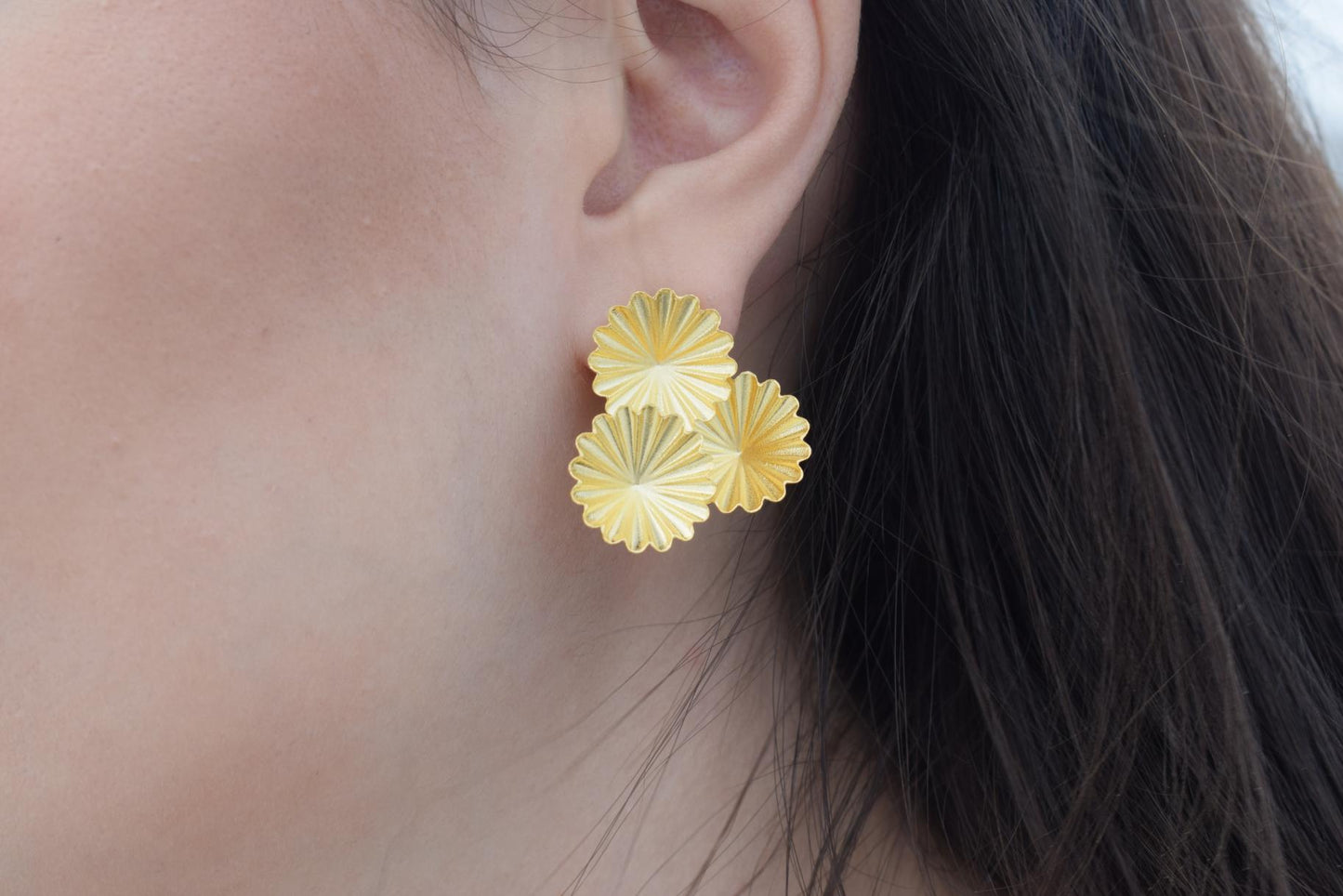 Florina earrings in Greek hammered jewelry design with floral texture, available in 18K gold plated and 18K silver plated finishes.