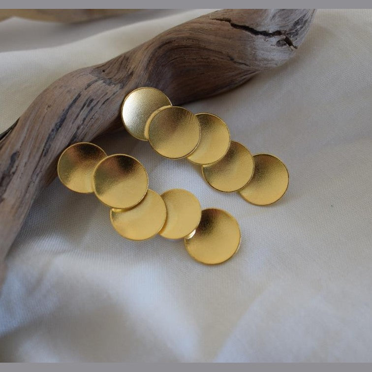 Mycenae earrings in Greek hammered circular design, available in 18K gold plated and 18K silver plated finishes.