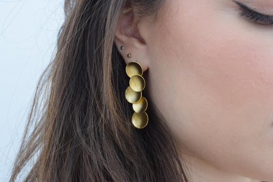 Mycenae earrings in Greek hammered circular design, available in 18K gold plated and 18K silver plated finishes.