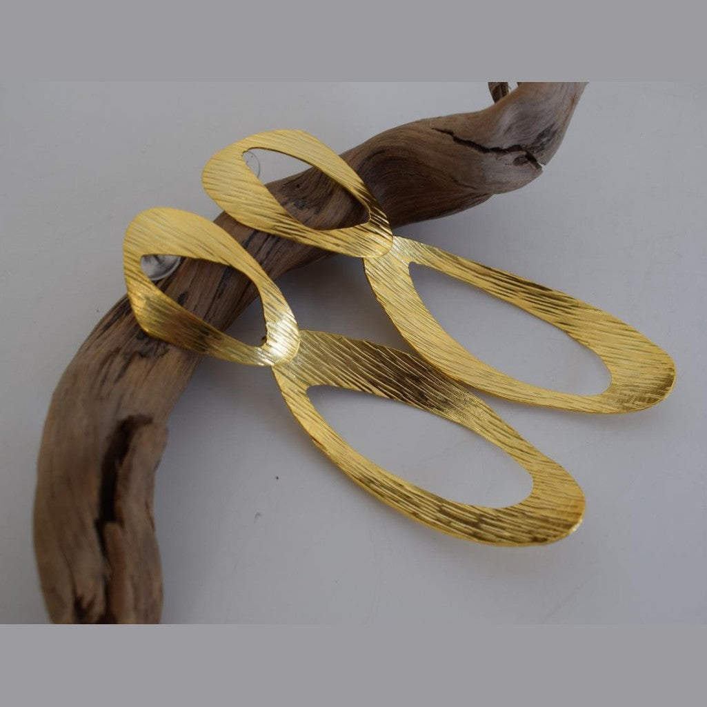 Ostraka earrings in Greek hammered open oval design, available in 18K gold plated and 18K silver plated finishes.