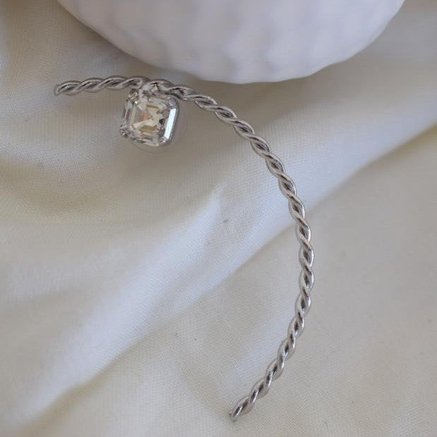 Okeanos earrings in Greek hammered twisted hoop design with fine crystals, available in 18K gold plated and 18K silver plated finishes.