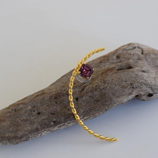 Okeanos earrings in Greek hammered twisted hoop design with fine crystals, available in 18K gold plated and 18K silver plated finishes.