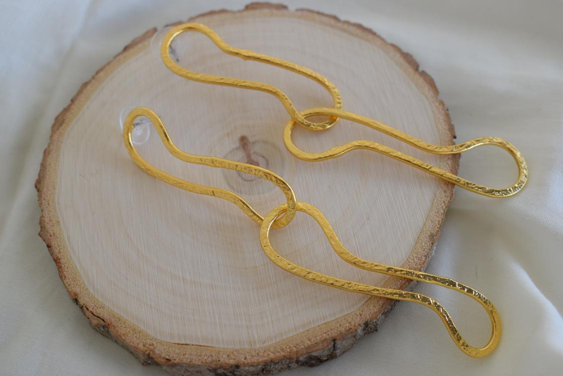 Aigle2 handmade Greek hammered earrings with an elongated sculptural design, available in gold and silver plated finishes.