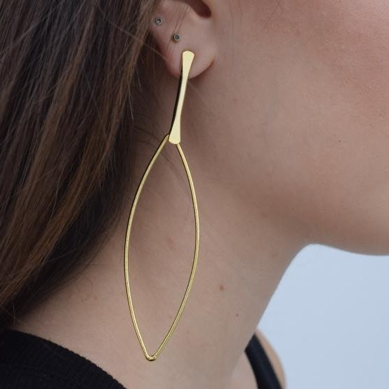 Nereis handmade Greek hammered long drop earrings with an open minimalist design, available in gold plated and silver plated.